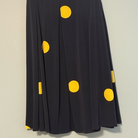 LuLaRoe Dresses & Skirts - LuLaRoe Black Skirt with Yellow Dots